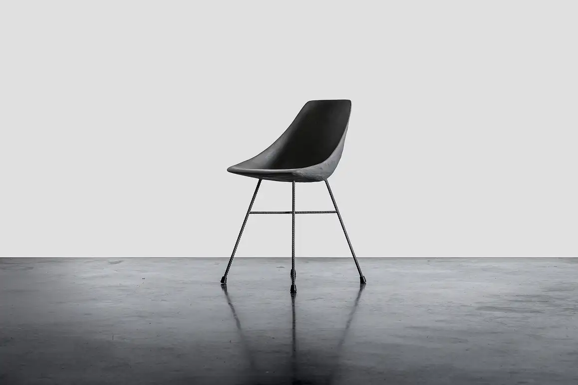 Hauteville anthracite concrete chair with exposed rebar legs — Lyon Béton